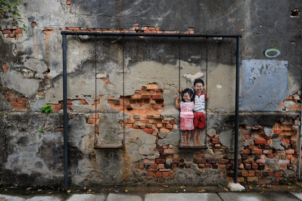 Children on a bicycle mural in George Town